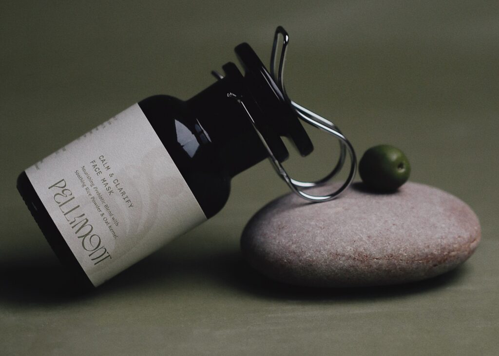 Glass bottle with spring clip